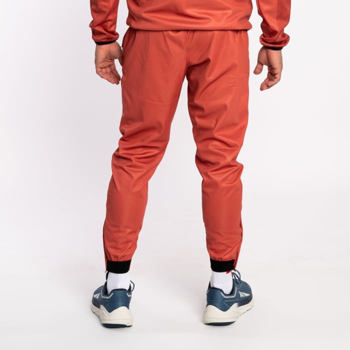orange nike track pants